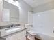 Bathroom featuring granite countertop, white cabinets, and shower-tub combo at 4239 Newcomb Rd, Decatur, GA 30034