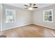 Bedroom with hardwood floors, large windows, and neutral walls at 4239 Newcomb Rd, Decatur, GA 30034