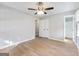 Bright bedroom featuring light wood floors, ceiling fan and closet at 4239 Newcomb Rd, Decatur, GA 30034