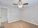 Light filled bedroom featuring wood floors, ceiling fan, and a bright ambiance at 4239 Newcomb Rd, Decatur, GA 30034