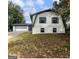 Charming home with a two-car garage, featuring white siding and a well-manicured lawn at 4239 Newcomb Rd, Decatur, GA 30034