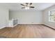 Open living room featuring hardwood floors, a modern ceiling fan and a staircase with white railing at 4239 Newcomb Rd, Decatur, GA 30034