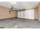 Spacious garage featuring concrete floors and a white garage door at 124 Silver Fox Trl, Dallas, GA 30157