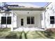 Covered back porch offers outdoor living space, seamlessly blending indoor-outdoor living at 152 Wet Wood Dr # 10, Fairburn, GA 30213