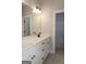 Bathroom featuring a double sink vanity with modern faucets and a view into the shower/tub combo at 152 Wet Wood Dr # 10, Fairburn, GA 30213