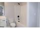 Clean bathroom with white tub, black hardware, white fixtures, and modern toilet at 152 Wet Wood Dr # 10, Fairburn, GA 30213