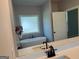 Bright bathroom featuring a soaking tub, tiled floors and double sink vanity with black fixtures at 152 Wet Wood Dr # 10, Fairburn, GA 30213