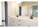 Bright bathroom with double vanity, white cabinets, black hardware, and neutral wall color at 152 Wet Wood Dr # 10, Fairburn, GA 30213