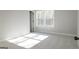 Bright bedroom featuring neutral carpets and a large window with natural light at 152 Wet Wood Dr # 10, Fairburn, GA 30213