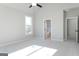 Bright, airy bedroom with carpet flooring, a ceiling fan and an ensuite bathroom at 152 Wet Wood Dr # 10, Fairburn, GA 30213