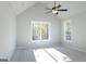 This large bedroom features high ceilings, two large windows, and neutral colored carpet at 152 Wet Wood Dr # 10, Fairburn, GA 30213