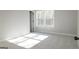Bedroom with bright window and neutral carpet at 152 Wet Wood Dr # 10, Fairburn, GA 30213