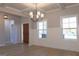 Dining room with hardwood floors, chandelier, and wainscoting, illuminated by large windows at 152 Wet Wood Dr # 10, Fairburn, GA 30213