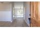 Inviting entryway with hardwood floors, light gray walls, white trim, and a glimpse of the bright living space at 152 Wet Wood Dr # 10, Fairburn, GA 30213