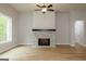 Inviting living room with a cozy stone fireplace and large windows at 152 Wet Wood Dr # 10, Fairburn, GA 30213