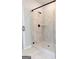 Walk-in shower is tiled in gray and features a shelf and black hardware at 152 Wet Wood Dr # 10, Fairburn, GA 30213
