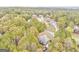 Aerial view showcasing a home nestled in a neighborhood surrounded by mature trees and well-maintained landscapes at 408 Gray Fox Dr, Canton, GA 30114