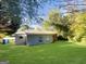Wide shot of home's green backyard featuring well-maintained grass at 828 Pinevalley Dr, Forest Park, GA 30297