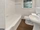 Clean bathroom showcasing a white tub, toilet, and sink at 828 Pinevalley Dr, Forest Park, GA 30297