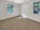 Bright bedroom featuring multiple windows and neutral wall-to-wall carpet at 828 Pinevalley Dr, Forest Park, GA 30297