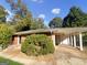 Cozy single-story brick home with a covered carport and a well-maintained yard at 828 Pinevalley Dr, Forest Park, GA 30297