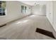 Bright living room with large windows offering abundant natural light and neutral carpet at 828 Pinevalley Dr, Forest Park, GA 30297