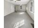 Spacious living area with ample natural light and neutral carpeting at 828 Pinevalley Dr, Forest Park, GA 30297