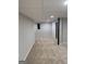 View of the finished basement featuring carpet flooring and neutral walls at 7193 Tara Dr, Villa Rica, GA 30180
