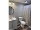 Bright bathroom features white vanity, updated fixtures, and shower with curtain at 7193 Tara Dr, Villa Rica, GA 30180