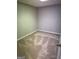 Cozy bedroom featuring plush carpeting, neutral walls, and closet at 7193 Tara Dr, Villa Rica, GA 30180