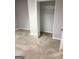 Spacious closet with open door features plush carpeting and shelving unit at 7193 Tara Dr, Villa Rica, GA 30180