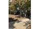 Charming gray home featuring a well-manicured front yard, natural landscaping, and a long driveway at 7193 Tara Dr, Villa Rica, GA 30180