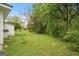 View of the backyard featuring mature trees at 734 W College St, Bowdon, GA 30108