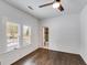 Bright bedroom showcases an ensuite bath with tile surround at 734 W College St, Bowdon, GA 30108