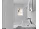 Clean bathroom featuring a white sink, a mirror, a toilet, and a shower at 734 W College St, Bowdon, GA 30108