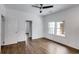 Bright bedroom features a ceiling fan and hardwood floors at 734 W College St, Bowdon, GA 30108
