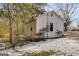 Image of house exterior with mature trees with a backyard and showing an air conditioning unit at 734 W College St, Bowdon, GA 30108