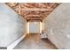 Interior view of the cinder block garage featuring an exposed wood beam roof at 734 W College St, Bowdon, GA 30108