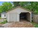 The garage is spacious, featuring one enclosed bay and one open bay at 734 W College St, Bowdon, GA 30108