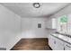 An inviting kitchenette featuring modern floors and cabinetry at 734 W College St, Bowdon, GA 30108