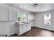 Bright and spacious kitchenette, equipped with nice floors, cabinets, and a double sink basin at 734 W College St, Bowdon, GA 30108