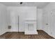 Bright living room features a brick fireplace at 734 W College St, Bowdon, GA 30108