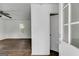 Living room area offering sleek floors and abundant natural light from a window at 734 W College St, Bowdon, GA 30108