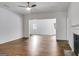 Inviting living room with hardwood floors, a fireplace, and an open layout with lots of natural light at 734 W College St, Bowdon, GA 30108