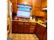 Functional kitchen with ample cabinet space, vintage countertops, and a window for natural light at 1723 Fort Valley Sw Dr, Atlanta, GA 30311