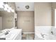 Bright and clean bathroom with tub, white vanity, and tile surround at 130 Nicki Ct, Hampton, GA 30228
