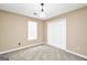 Simple bedroom includes neutral carpet, a window, and a closet for ample storage at 130 Nicki Ct, Hampton, GA 30228