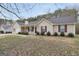 Charming single-story home with a well-maintained front yard, covered porch, and inviting curb appeal at 130 Nicki Ct, Hampton, GA 30228