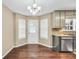 Well-lit kitchen featuring sleek appliances, granite countertops, and a breakfast nook at 130 Nicki Ct, Hampton, GA 30228