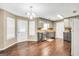 Well-lit kitchen featuring sleek appliances, granite countertops, and ample cabinet space at 130 Nicki Ct, Hampton, GA 30228